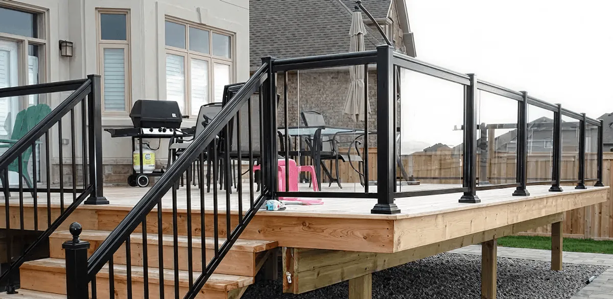 Handrail installation on a deck staircase for safety and code compliance in Atlanta, GA